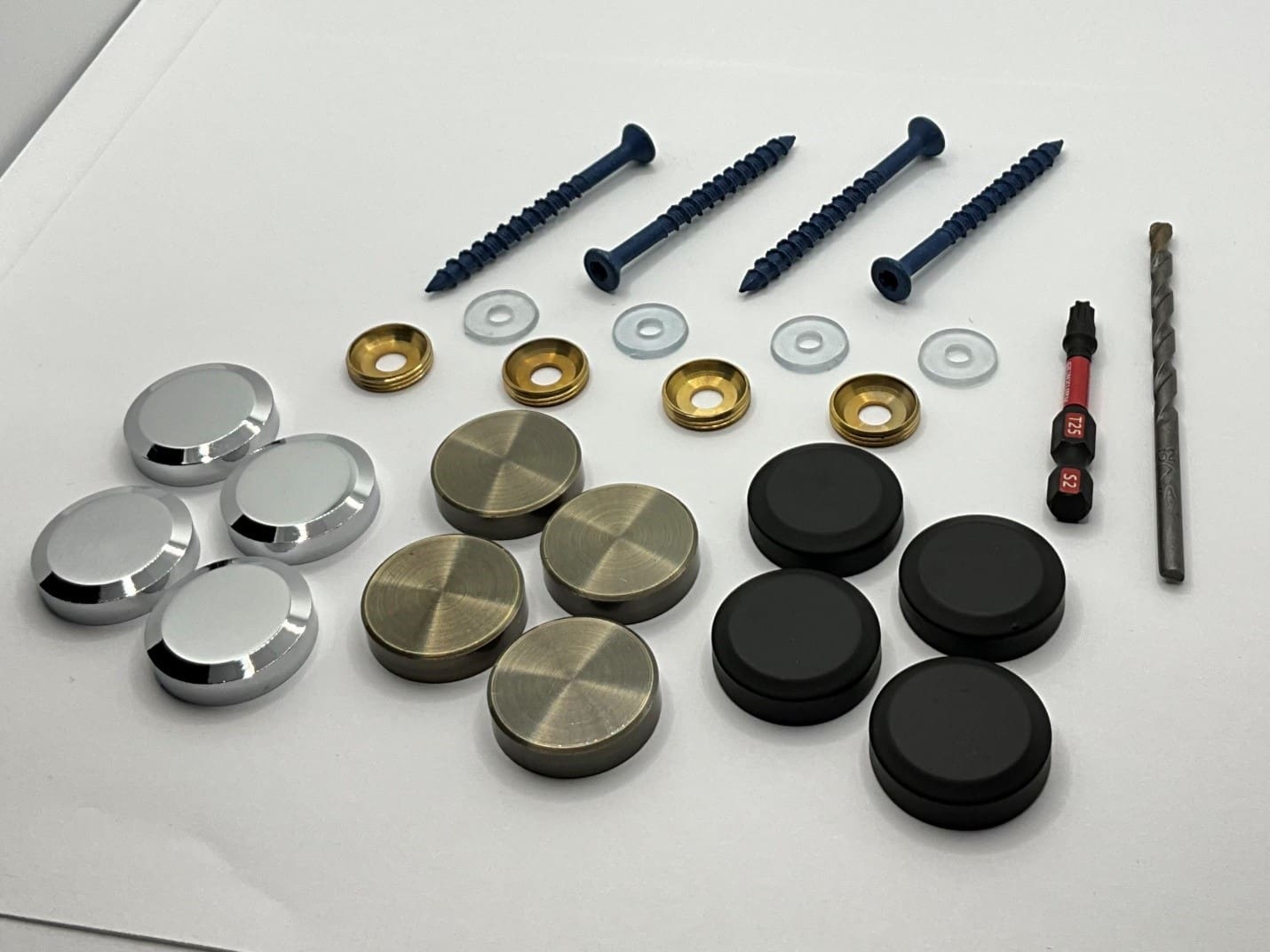 Screws, washers, caps, and drill bit set.