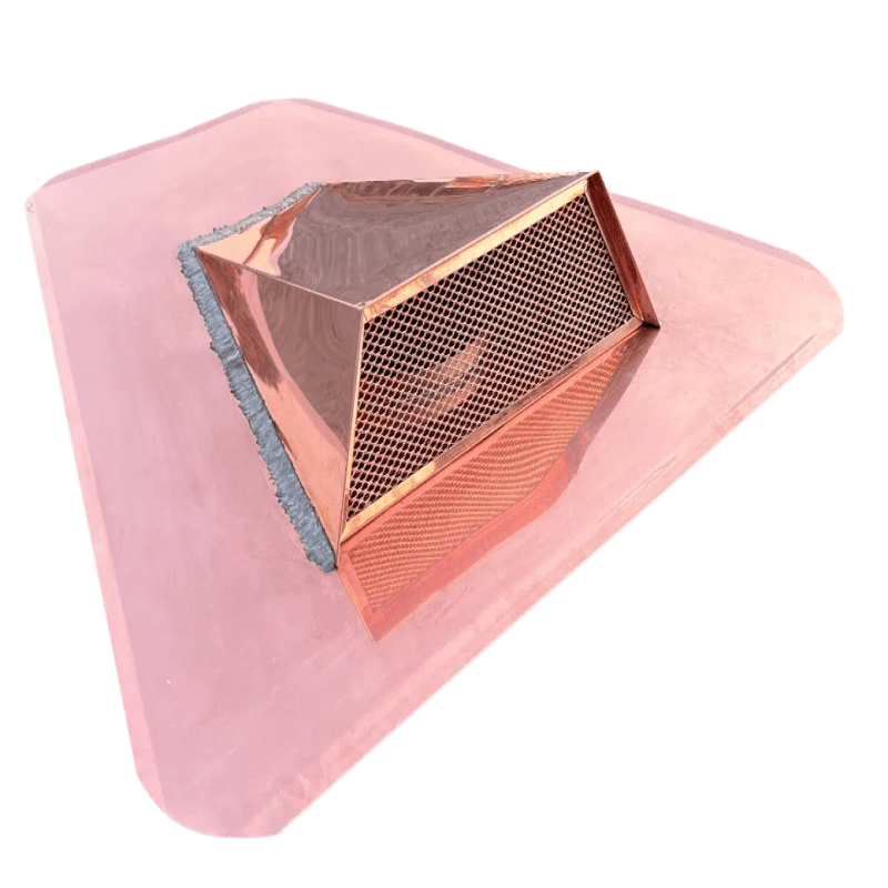 Copper roof vent with mesh on black background.