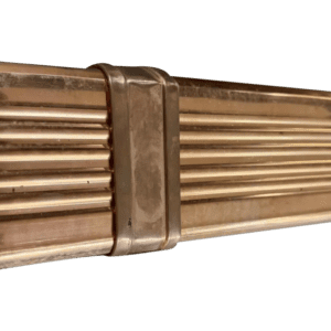 Copper pipe with ridged texture and joint.