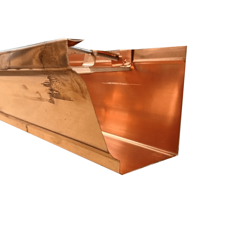 Copper gutter section on black background.